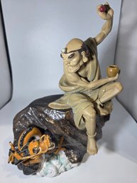 Shiwan Pottery Figurine Of The Taming Dragon Lohan Figurine