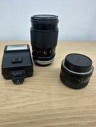 Camara Lens And Flash Light And Other Items