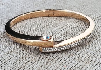 Elegant Gold-Tone Hinged Bangle Bracelet With Crystal Accent  Classic Modern Design