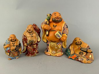 Group Of Four Hotei Statues In Varying Sizes