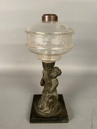 Antique Oil Lamp Base. Woman Holding Torch