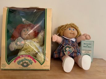 Two Cabbage Patch Kids With Birth Certificates, One In Original Box