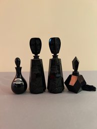 4 Small Black Glass Bottles