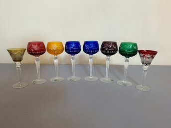 Eight Colored Cut Crystal Glasses