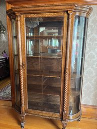 Antique Twisted Wood, Curved Glass, Claw Feet Curio Cabinet On Casters