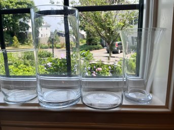 Four Clear Glass Cylinder Shaped Vases Or Candle Holders - K31