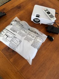 RCA Combo Pack Home Theater Projector & Fold Up Screen