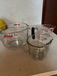 Three Pyrex Measuring Cups