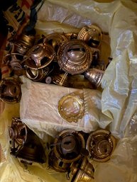 A Box Of Hurricane Lamp Parts Brass