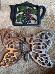 A Pair Of Trivets Butterfly And Grapes