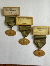 A Collection Of Three Badge Holders With Original Green Ribbon From The AMA