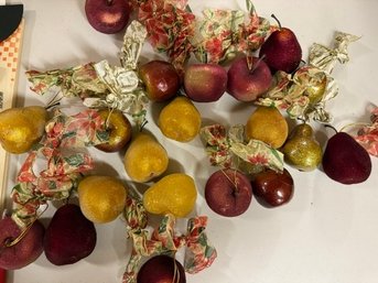 A Collection Of Faux Fruit Ornaments
