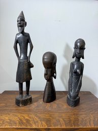 A Group Of Three Carved African Sculptural Figures