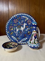 A Group Of Hand Painted Ceramics, Including A Pitcher, Bowl And Platter From Israel