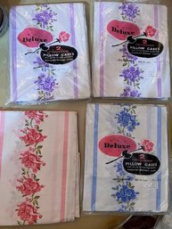 A Group Of Vintage Pillow Cases In Orginal Packaging, Pink Is A Single