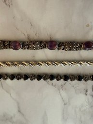 A Group Of Three Silver Onyx, Sterling And Amethyst, And Sterling Rope Bracelets