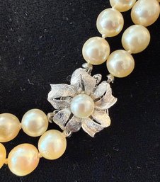 Double Strand Of Knotted Creamy Pearls With White Gold Floral Clasp