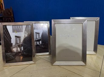 A Group Of 4 Silver Tone Photo Frames 5 X 7'