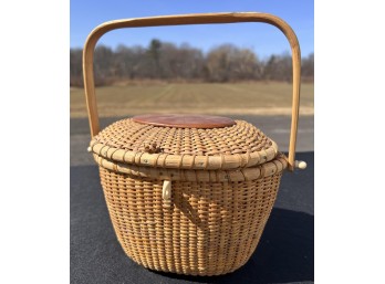 SIGNED SWING HANDLE COVERED NANTUCKET BASKET