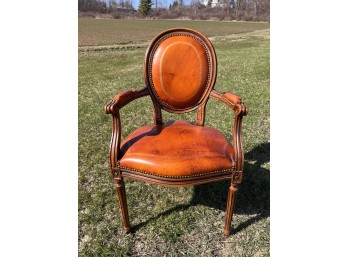 CARVED FRENCH STYLE LEATHER UPHOLSTERED ARMCHAIR
