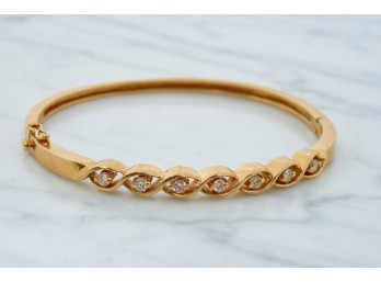 14k GOLD HINGED BANGLE BRACELET set with DIAMONDS