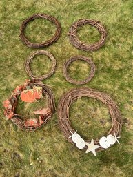 GROUPING  OF BENT TRIG WREATHS WITH DECORATIONS