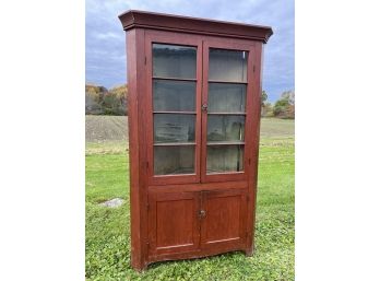 EARLY RED PAINTED CORNER CUPBOARD