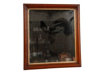 ANTIQUE WALNUT FRAMED MIRROR