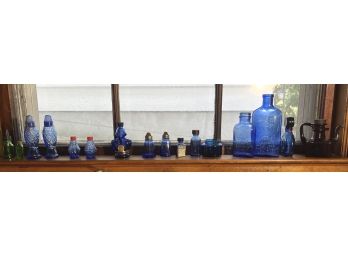 SHELF of COLORED GLASS