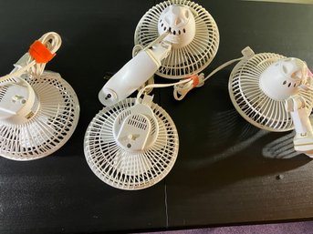 Four White Clip-on Portable Plug-in Fans