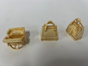 16. Miniature Carved Bone Purses (3)