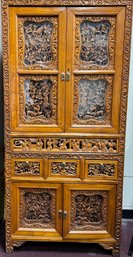 16. Chinese Heavily Carved Wood Cabinet