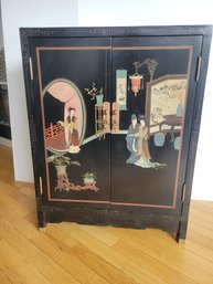 Chinese Black Lacquer Cabinet Featuring Hand-painted Chinoiserie Scenes And Brass Hardware