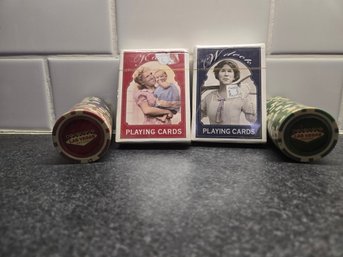 Satirical Political Playing Cards Alongside Las Vegas-themed Casino Chips.