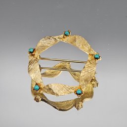 Gold-tone Circle Brooch With Turquoise-colored Stones.
