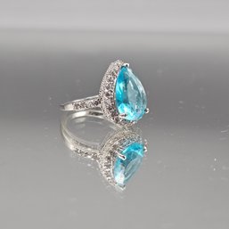 Pear-Cut Electric Blue Topaz Halo Ring In Silver Tone - Size 6.25