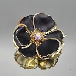 Vintage Black Enamel Flower Brooch With Aurora Borealis Rhinestone Center