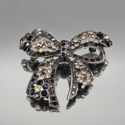 Vintage Ornate Rhinestone Bow Brooch  Gunmetal Tone With Black & Champagne Crystals