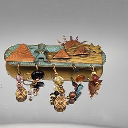 Mixed-Metal Southwestern Narrative Brooch With Dangles