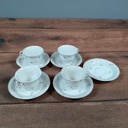 Set Of White Porcelain Tea Cups And Saucers With Blue Floral Design