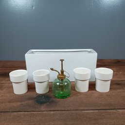 White Ceramic Plater Grouping And Green Glass Spray Bottle