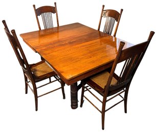 Vintage Solid Wood Table With Intricate Carved Accents & Cane Seat Chairs