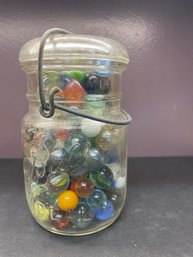 VINTAGE JAR WITH MARBLES