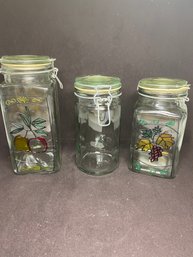 Lot Of 3 Swing Top Glass Canisters With Grapes And Apple Patterns