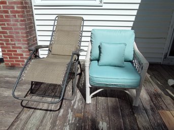 2 Piece Patio Furniture Lot - A Zero Gravity Type Chair Together With A Rattan Style Chair