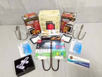 Box Lot Of Mostly New Household Items, Including Small Heaters, Emergency Radio, HD TV Antena, Etc