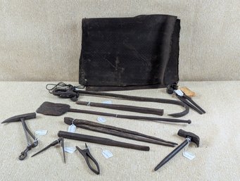 Collection Of Antique Mostly Hand Wrought Iron Blacksmithing Tools Including An Old Apron