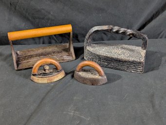A Large Sad Iron - Two Miniature Sad Irons And A Bacon Press