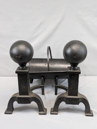 Pair Of Cast Iron Cannon Ball Top Andirons Together With A Magazine / Kindling Holder