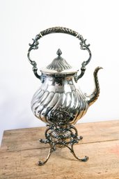 Beautiful 19th C Victorian Silver Plated Kettle On Stand Including Ivory Hangers Resting On A Stove With Feet.